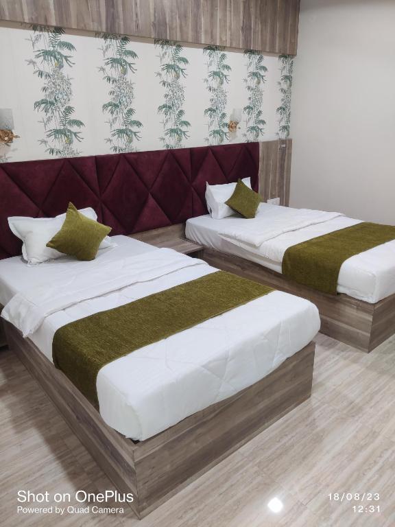 Postel nebo postele na pokoji v ubytování Hotel Praj Paradise