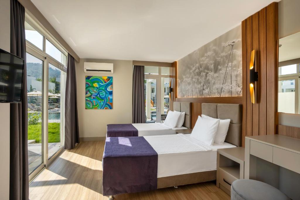 Postel nebo postele na pokoji v ubytování Simena Comfort Hotel