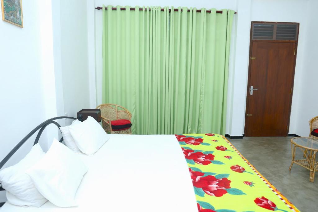 Postel nebo postele na pokoji v ubytování Sandy Palms Guesthouse