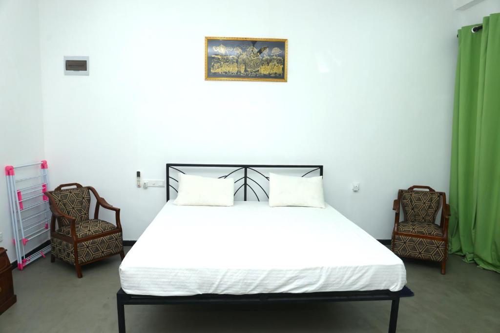 Postel nebo postele na pokoji v ubytování Sandy Palms Guesthouse