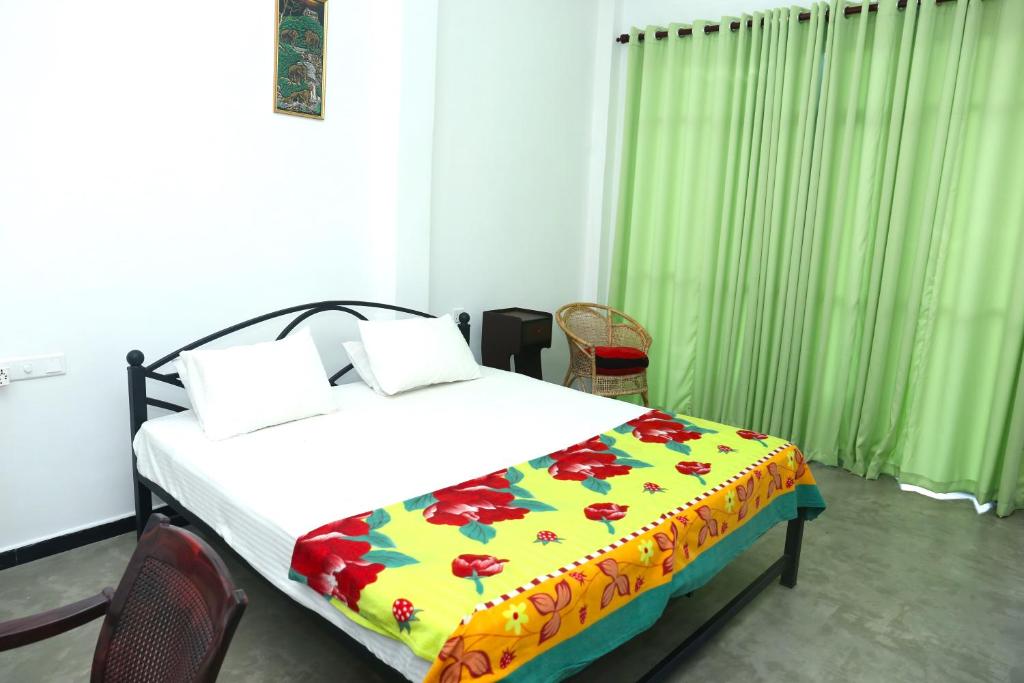 Postel nebo postele na pokoji v ubytování Sandy Palms Guesthouse