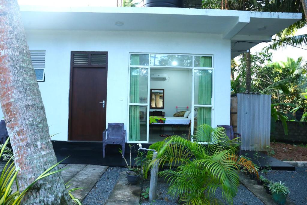 Zahrada ubytování Sandy Palms Guesthouse
