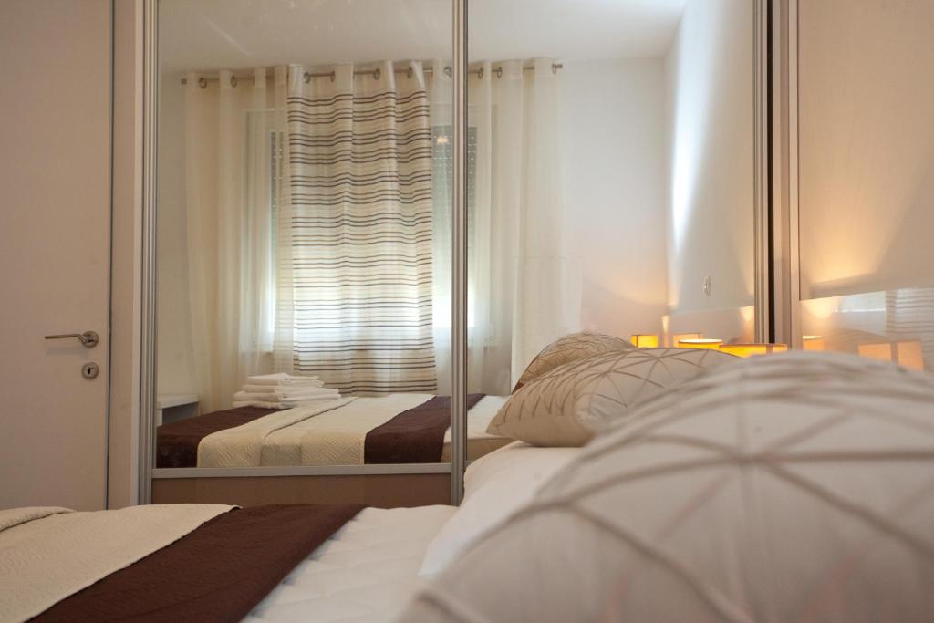 Postel nebo postele na pokoji v ubytování Apartments Diamond
