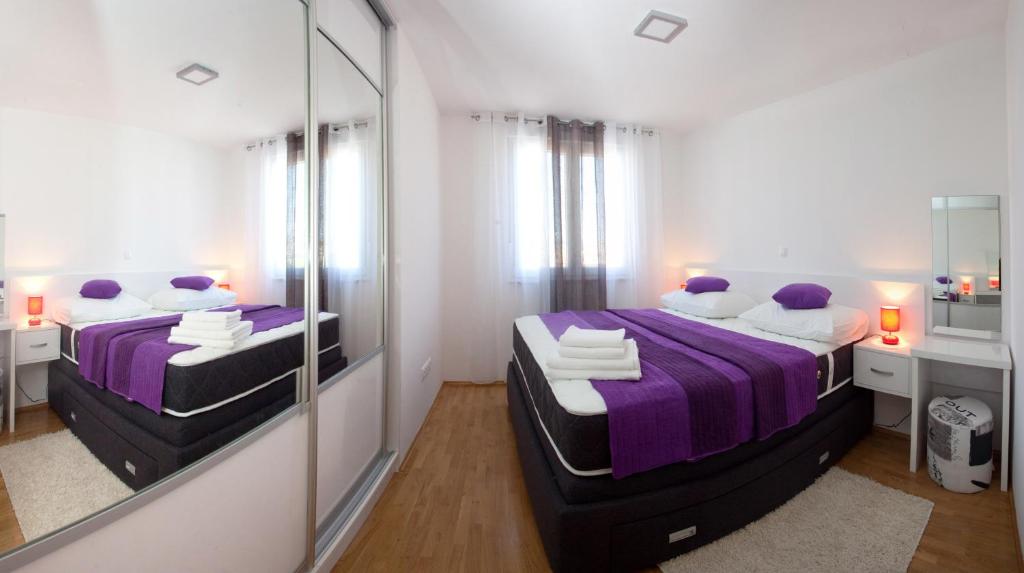 Postel nebo postele na pokoji v ubytování Apartments Diamond