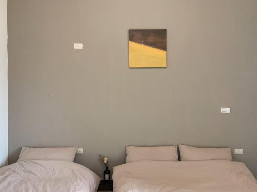 Postel nebo postele na pokoji v ubytování White Cat B&B