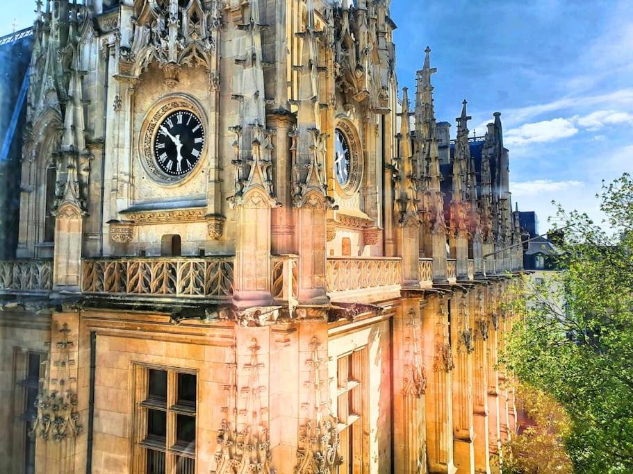 a large building with a clock tower on it at suite st lo 2 in Rouen