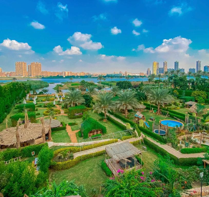 an aerial view of a park with a city in the background at IL CAMPO Ecolodge & Boutique Hotel in Cairo