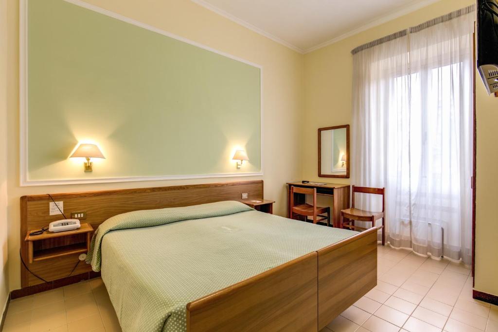 Letto o letti in una camera di Hotel Igea