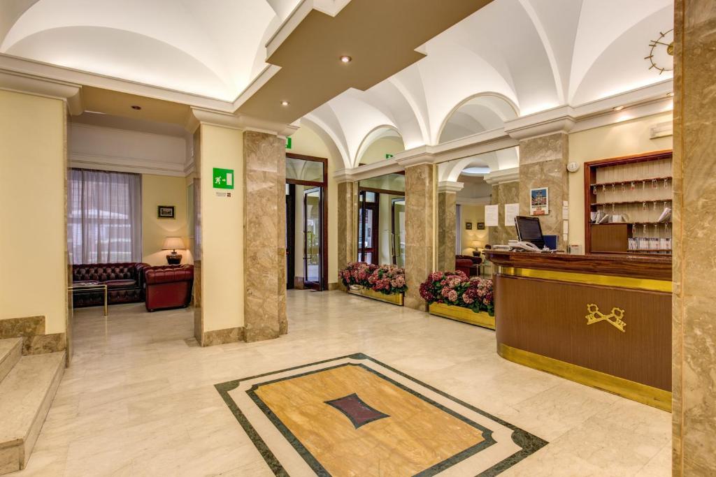 a lobby of a hotel with a pharmacy at Hotel Igea in Rome