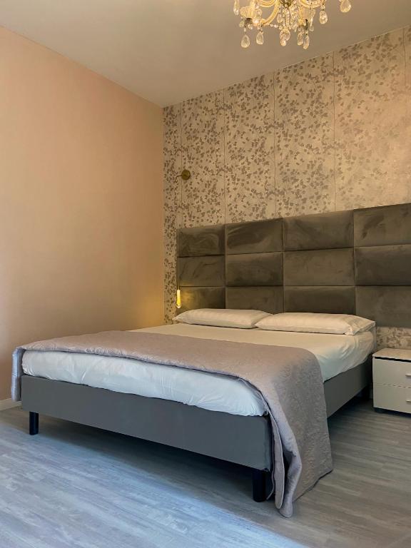 Posteľ alebo postele v izbe v ubytovaní Casa Rosmini rooms, Dolomia best home