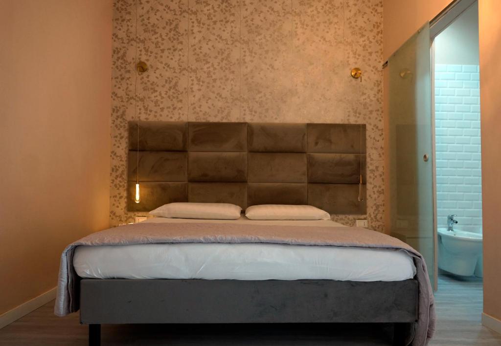 Posteľ alebo postele v izbe v ubytovaní Casa Rosmini rooms, Dolomia best home