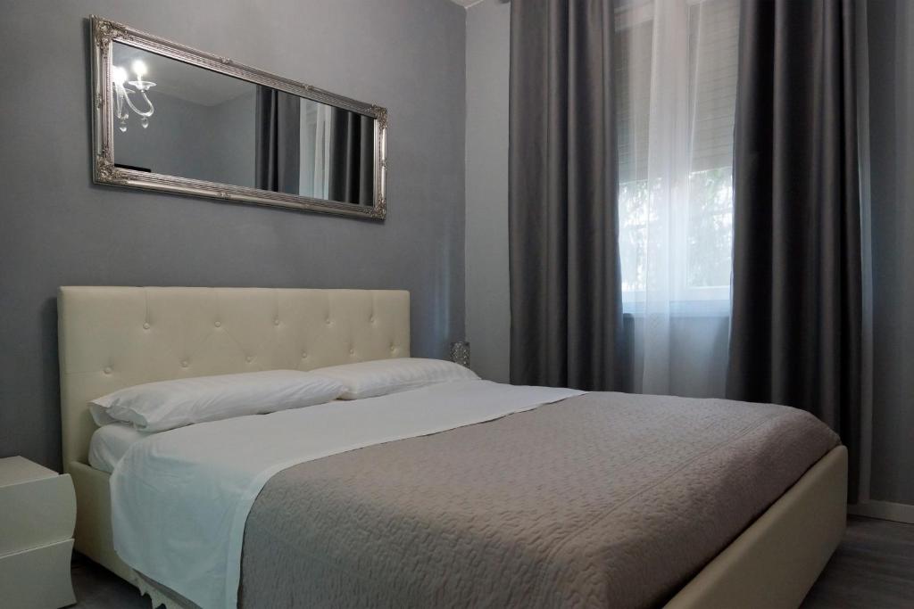 Posteľ alebo postele v izbe v ubytovaní Casa Rosmini rooms, Dolomia best home