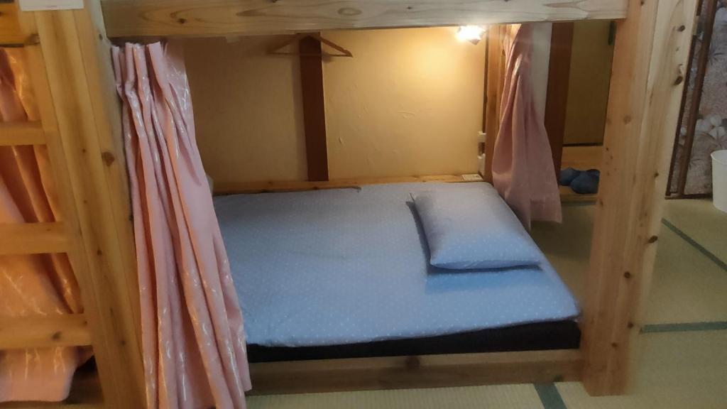 Postel nebo postele na pokoji v ubytování Hostel Caranashi