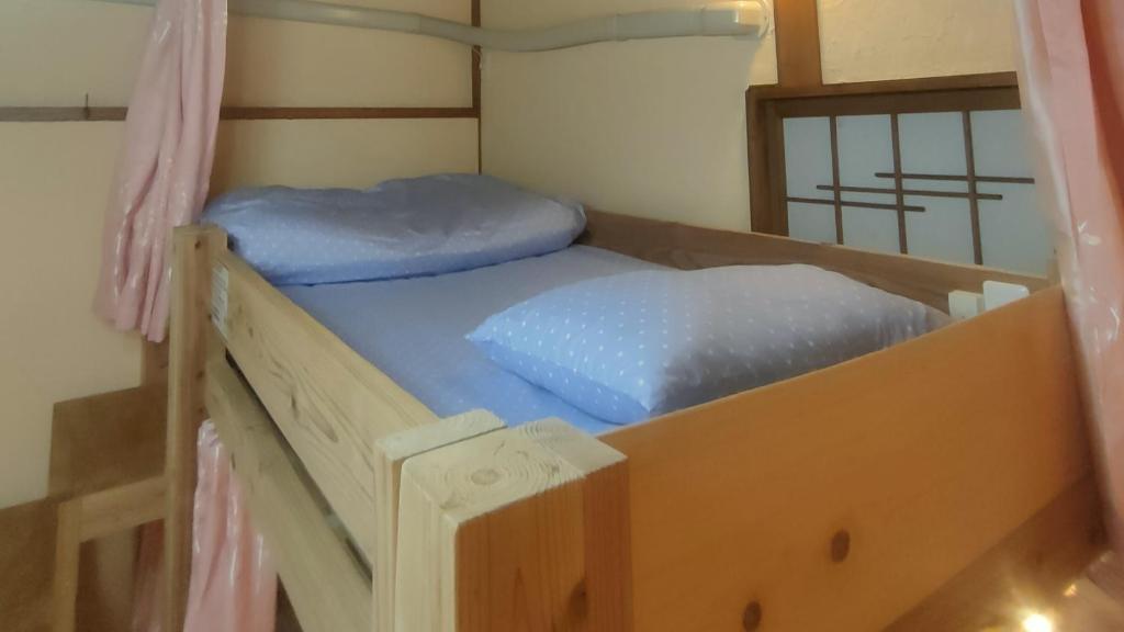 Postel nebo postele na pokoji v ubytování Hostel Caranashi