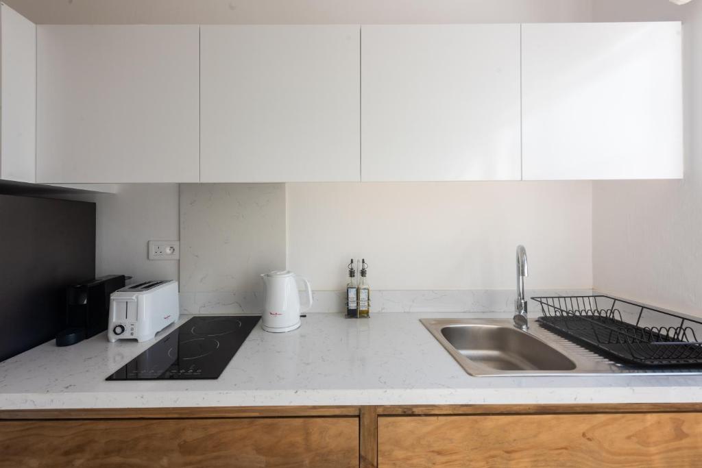 Кухня или мини-кухня в Dodo Square Residence
