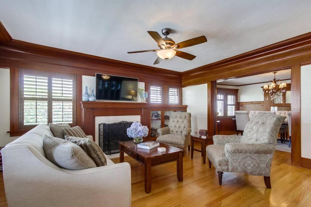 a living room with a couch and a ceiling fan at Cozy Craftsman Bungalow, Hillcrest/Mission Hills in San Diego