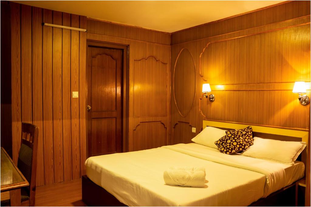 Postel nebo postele na pokoji v ubytování Nag Pukhu Guest House