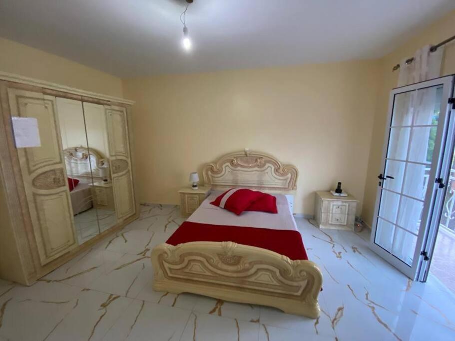 Postel nebo postele na pokoji v ubytování Maison familiale à Tarrafal.