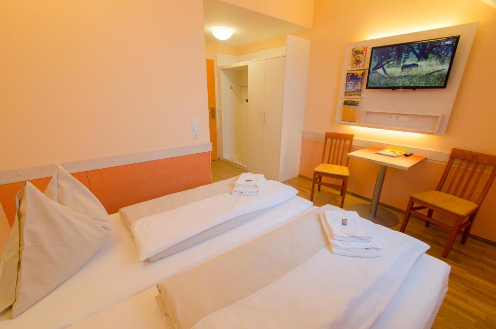 Postel nebo postele na pokoji v ubytování JUFA Hotel Hochkar