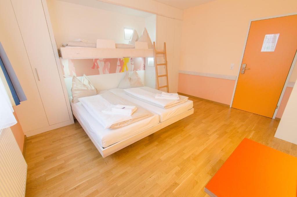 Postel nebo postele na pokoji v ubytování JUFA Hotel Hochkar