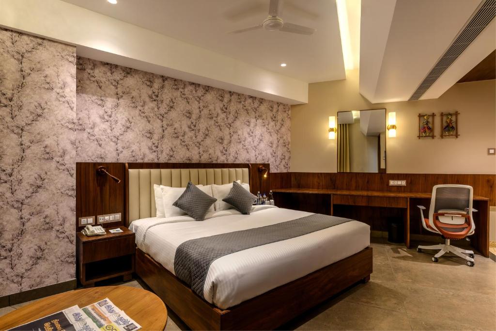 Postel nebo postele na pokoji v ubytování Sundex Hotel