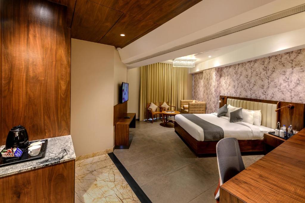 Postel nebo postele na pokoji v ubytování Sundex Hotel