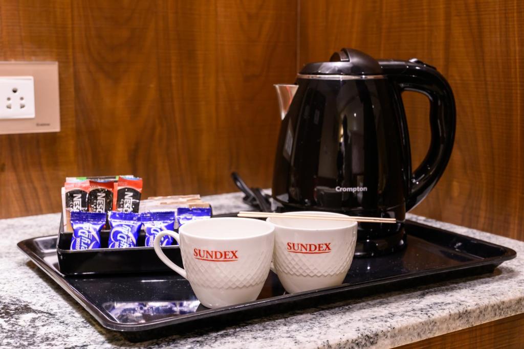 Příslušenství pro přípravu čaje a kávy v ubytování Sundex Hotel