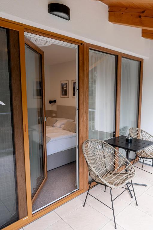 Łóżko lub łóżka w pokoju w obiekcie Resort-Restaurant Stilec