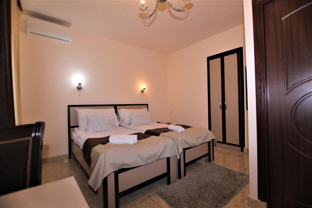 Postel nebo postele na pokoji v ubytování Comfort House Hotel