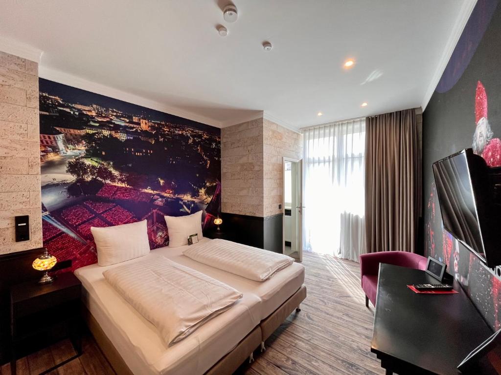 TV a/nebo společenská místnost v ubytování HOTEL CENTRAL FULDA
