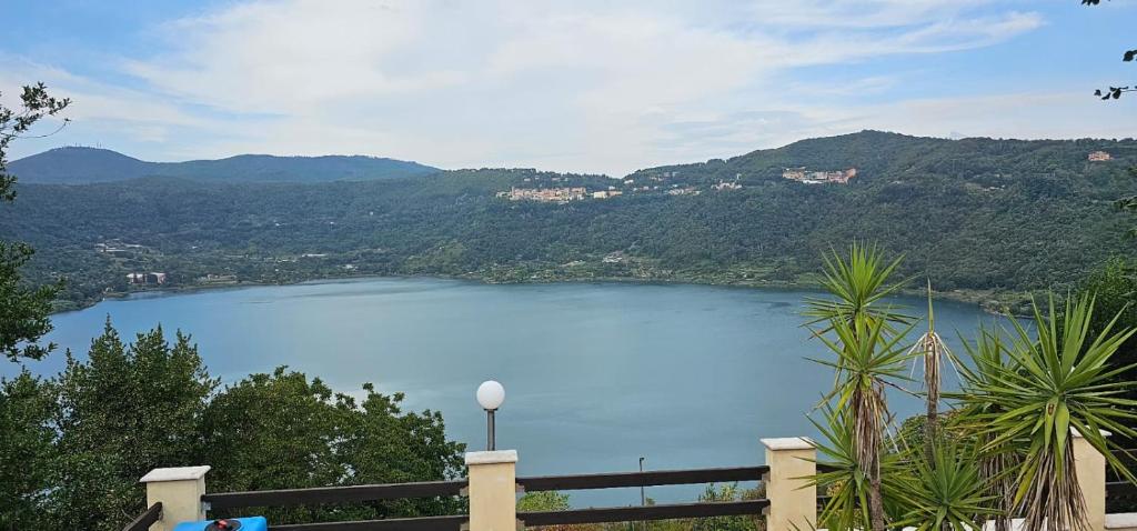 a view of a lake with mountains in the background at La Dimora del Lago in Genzano di Roma