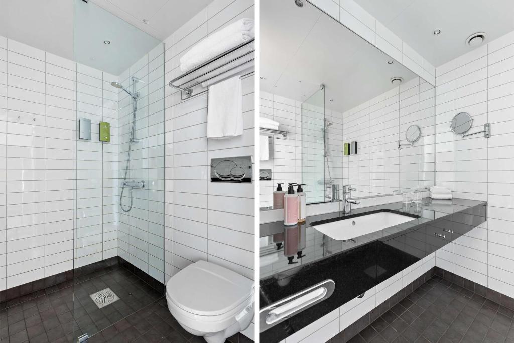 a white bathroom with a toilet and a sink at Best Western Plus Sthlm Bromma in Stockholm