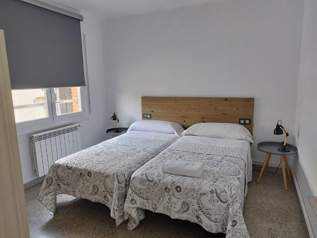 Llit o llits en una habitació de Apartament IXA-2