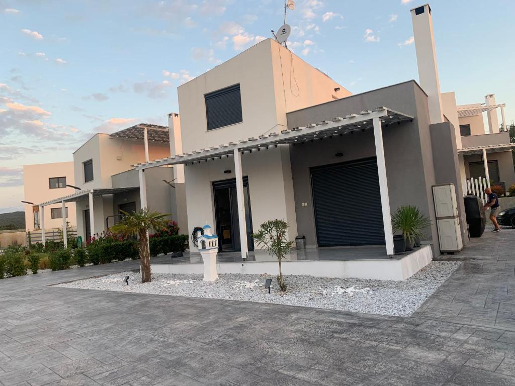 a house with a parking lot in front of it at Sulashome in Tsáyezi