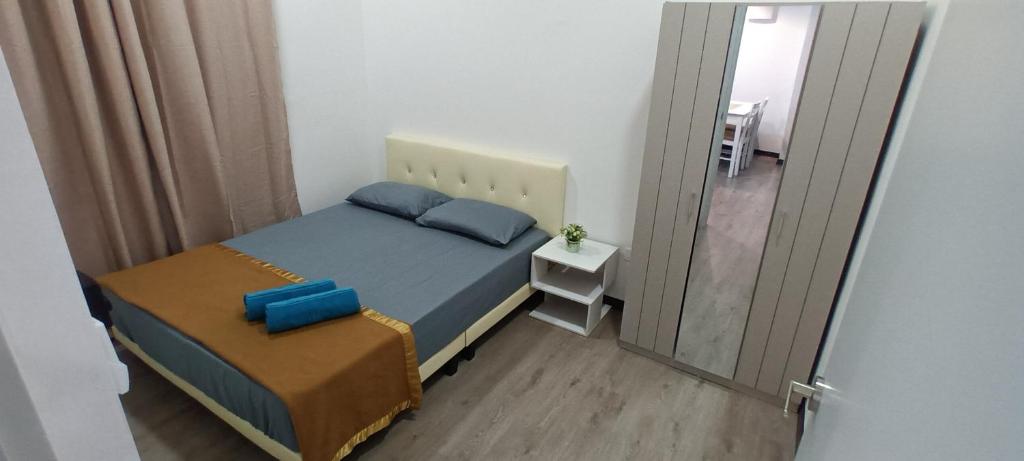 Postel nebo postele na pokoji v ubytování Singgahsini Guesthouse Putrajaya