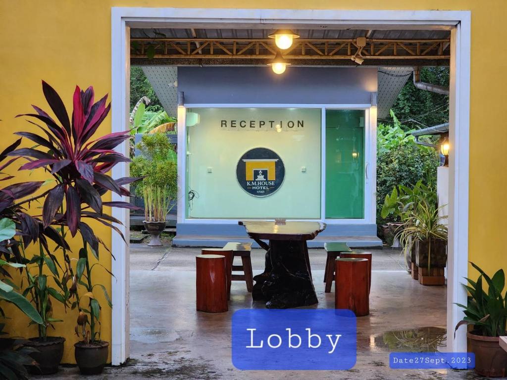 a sign for the reception lobby of a hotel at K.M. House in Krabi