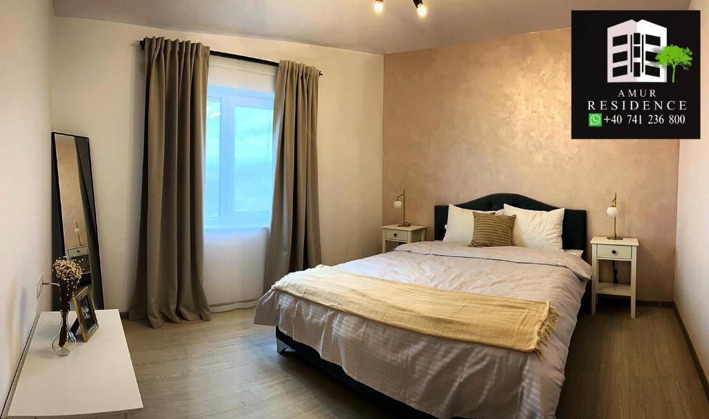 a bedroom with a bed and a window at AmurResidence S4 Sauna -parcare privata- 3 camere in Iaşi