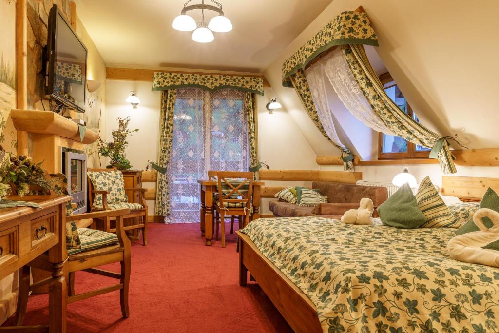 Postel nebo postele na pokoji v ubytování Leśny Dworek Zakopane