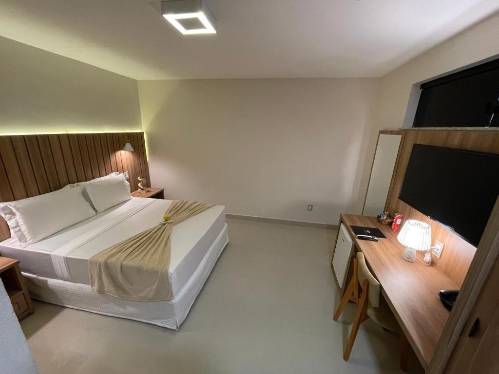 Postel nebo postele na pokoji v ubytování Principe do Mutá Hotel Design
