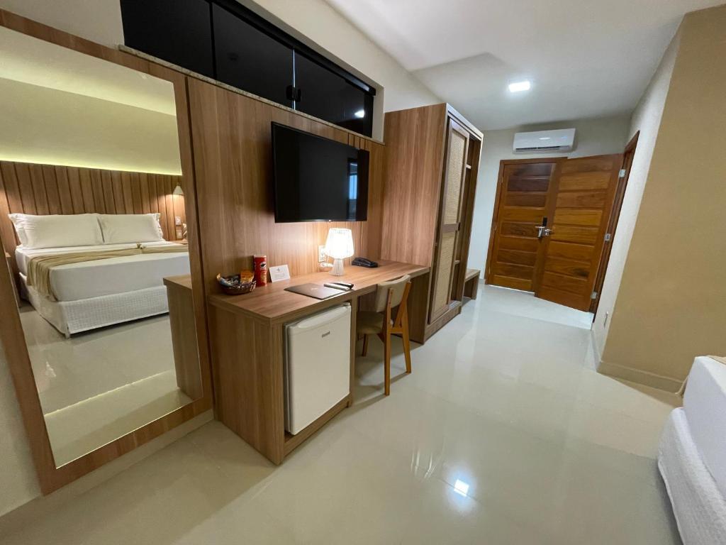 Postel nebo postele na pokoji v ubytování Principe do Mutá Hotel Design