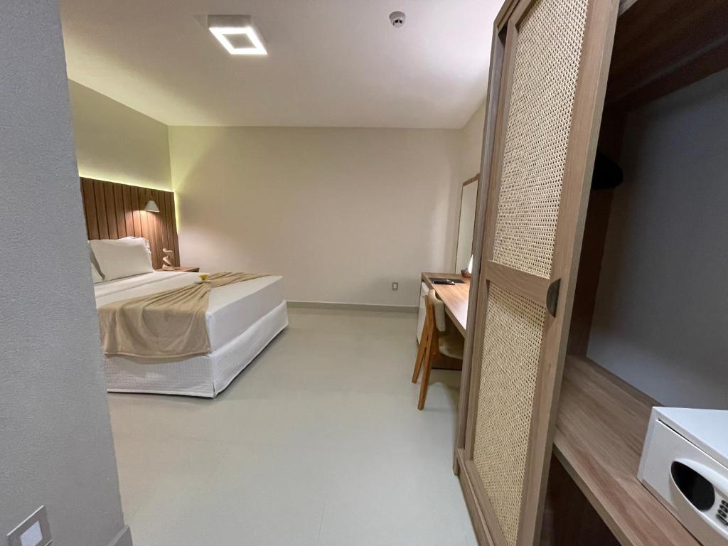 Postel nebo postele na pokoji v ubytování Principe do Mutá Hotel Design