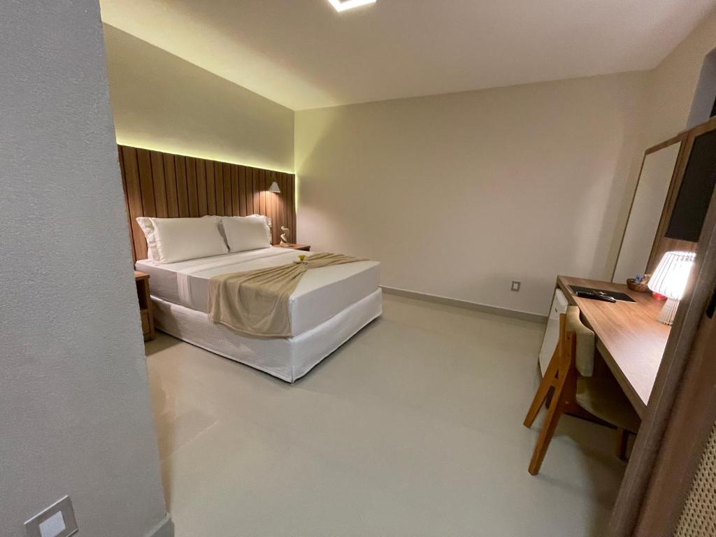 Postel nebo postele na pokoji v ubytování Principe do Mutá Hotel Design