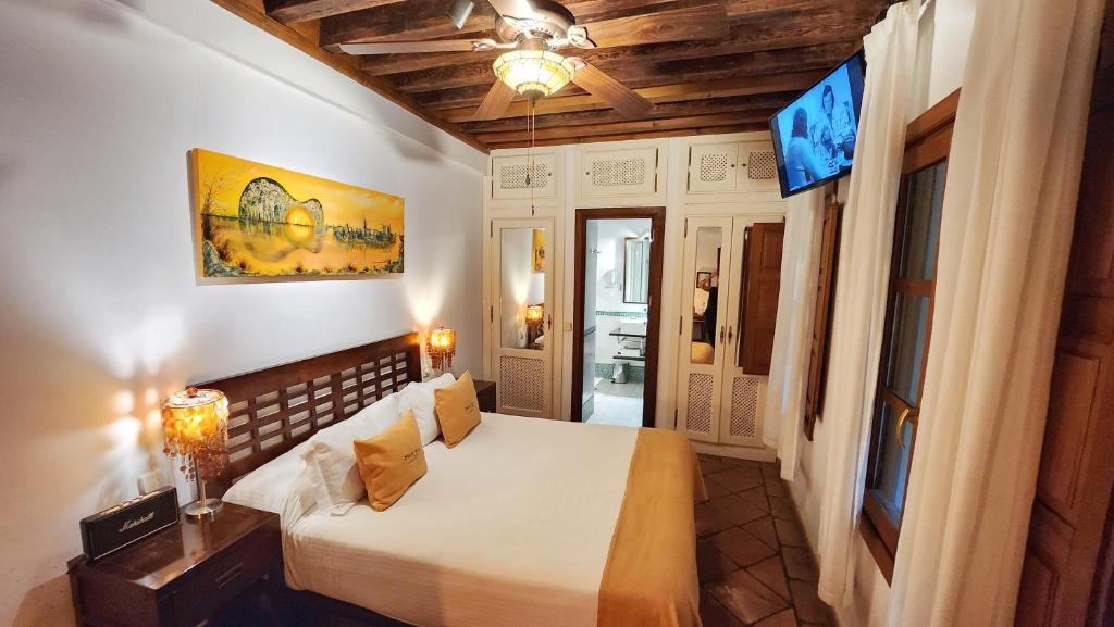 Postel nebo postele na pokoji v ubytování Entre Dos Aguas Hotel Boutique