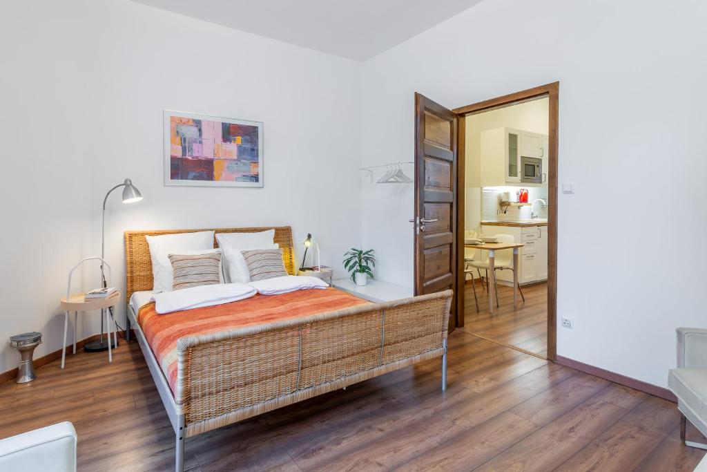 a bedroom with a bed and a mirror at Central Avenue Apartment in Budapest