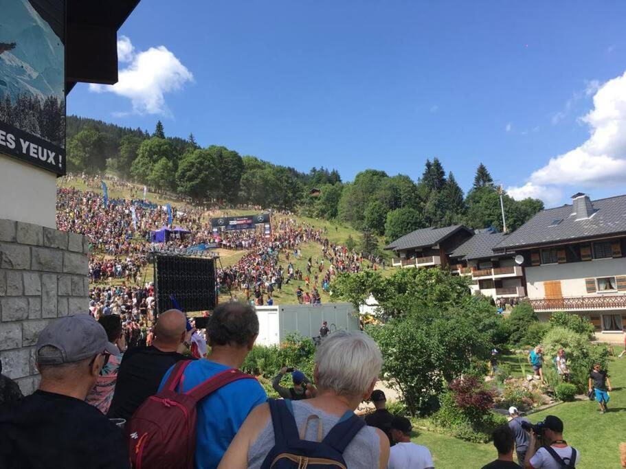 a large crowd of people standing on a hill at Les Gets apartment in Les Gets