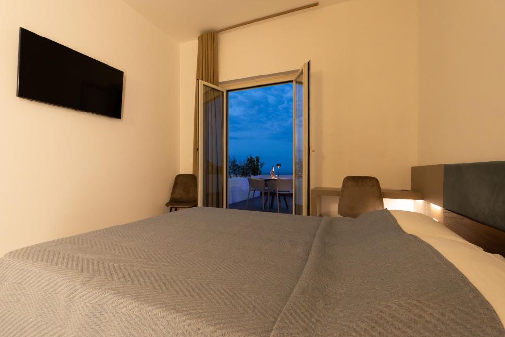 Postel nebo postele na pokoji v ubytování Terrazza sul Mare