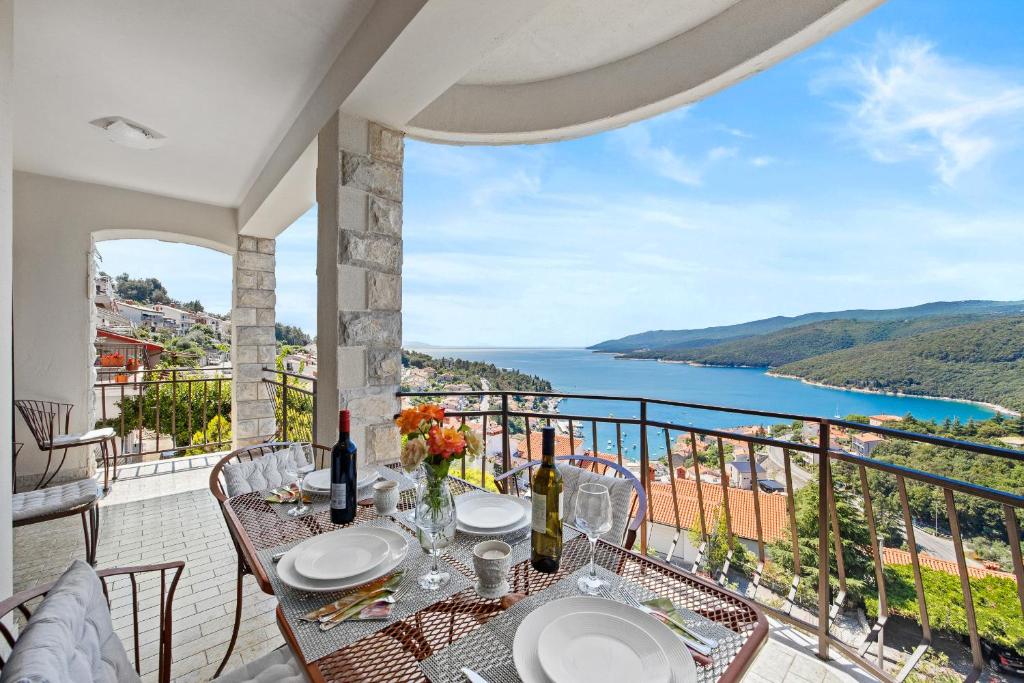 a dining room with a view of the ocean at LadyM in Rabac