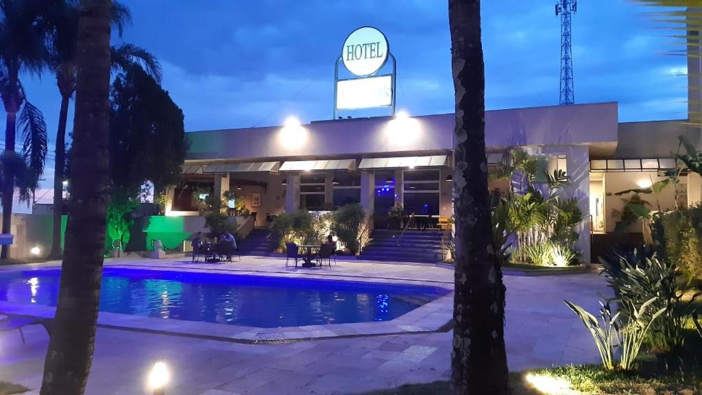 a view of the front of a hotel at night at Attiê Park Hotel in Uberlândia