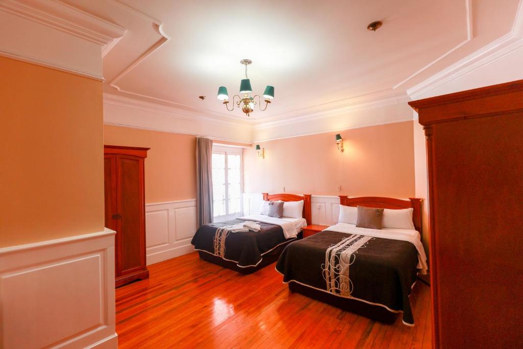 Postel nebo postele na pokoji v ubytování Hotel Real Del Monte