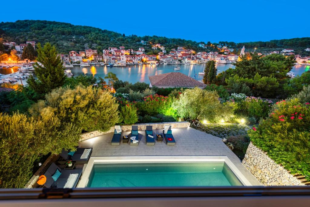 an aerial view of a house with a swimming pool at Villa Marceline in Prvić Luka